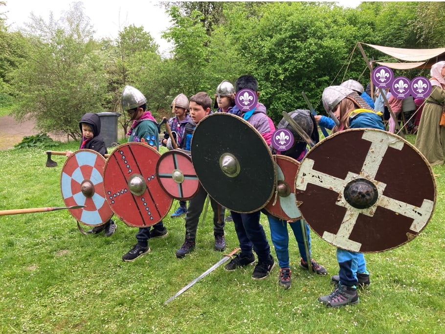 Coniston Cubs dressed up as Vikings with helmets, shields and swords.
