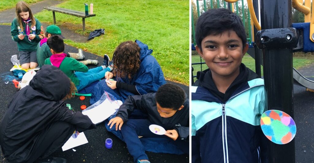 Two photos, one of a group of Coniston Cubs sat on the ground making Rangoli artwork with sand, and another picture of Coniston Cub Divit holding up his finished Rangoli picture.